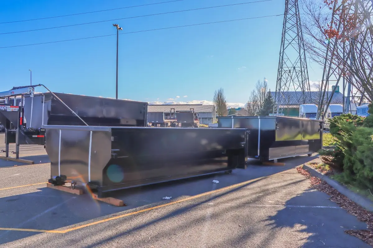Roll-off dumpster ready for waste disposal at job site for Construction Dumpster Rental in East Providence